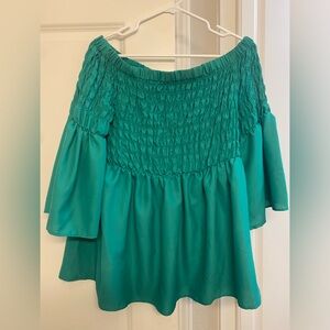 Babydoll top with bell sleeves and ruching.